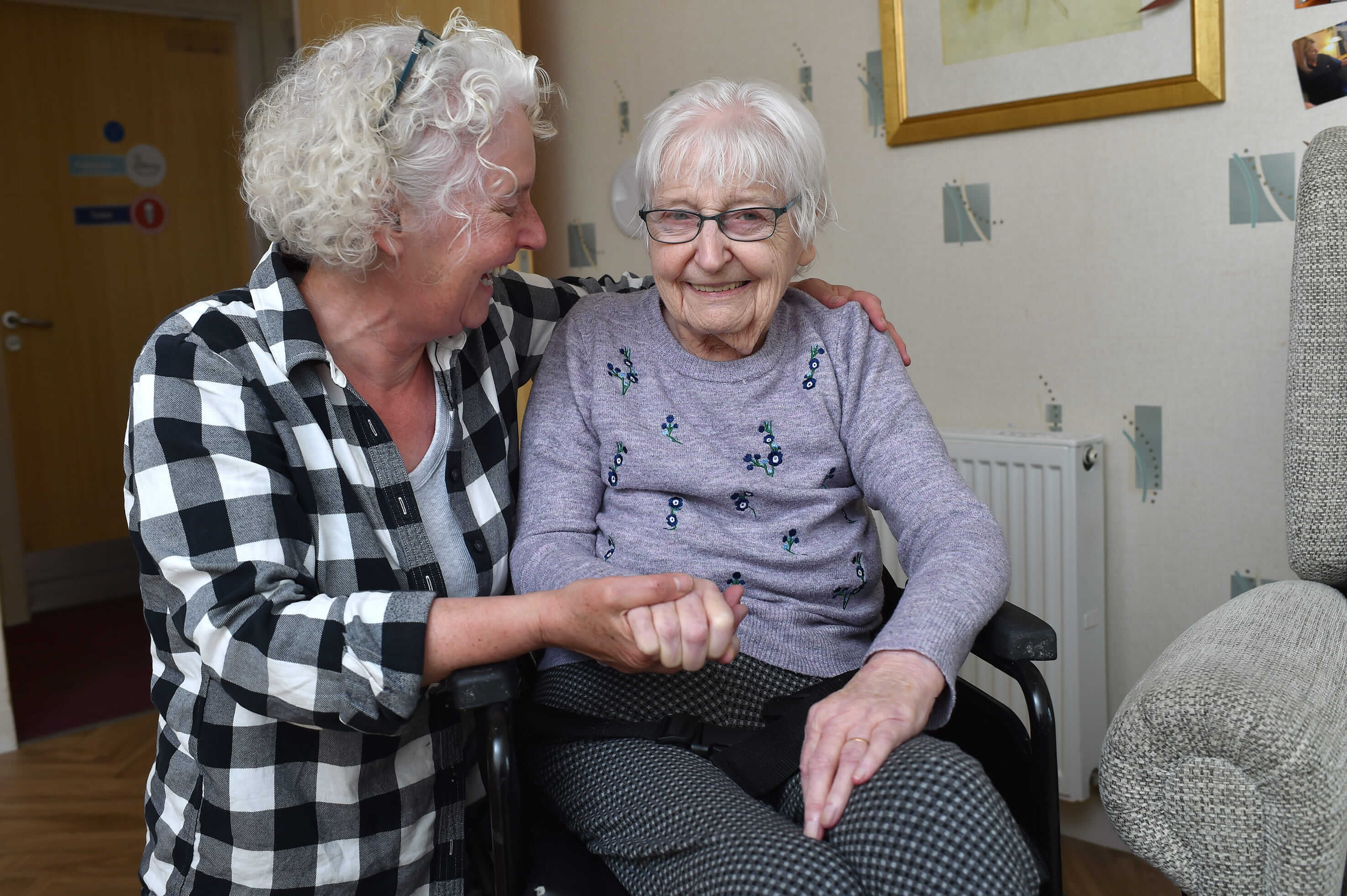 A moment of connection between a carer and resident